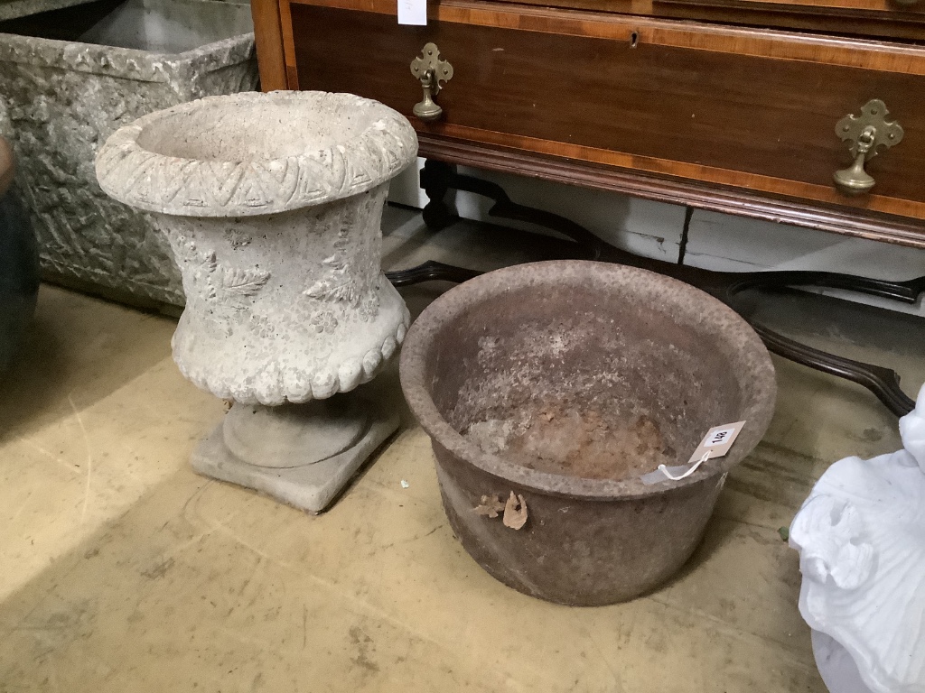 A reconstituted stone planter, height 44cm on base together with a circular cast iron garden planter, width 38cm